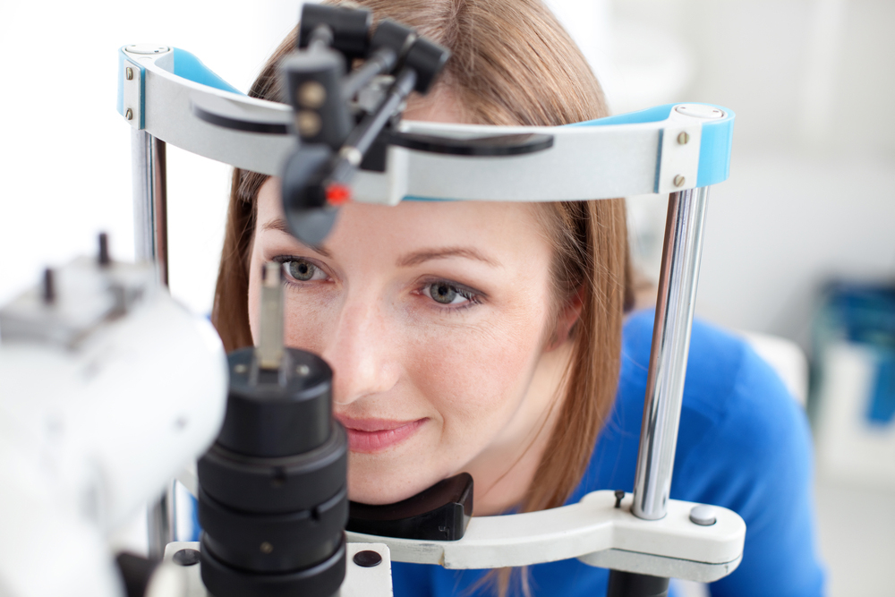 Woman getting a comprehensive eye exam.
